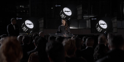 Catherine make a speech at the switching off of the Bat-Signal