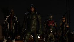 Team Arrow in the field led by John Diggle