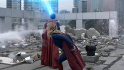 Superman and Supergirl fight on rooftop