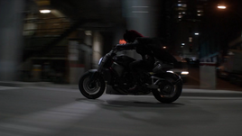 Batwoman on motorcycle