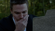 Oliver shedding tears over a grave