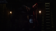 Grodd lifts Barry by the throat