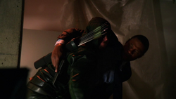 Diggle is rescued by the Hood.
