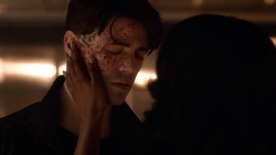 Iris touches Savitar's face