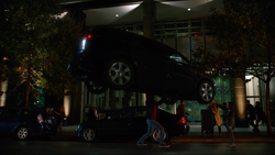 Mon-El stops a car