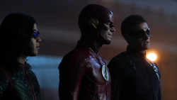 Flash, Vibe and Elongated Man try to save Izzy Bowin