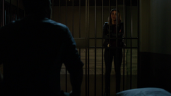 Dinah asks Oliver if he should be released from custody