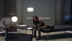 Nora in prison at the Time Bureau