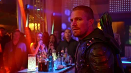 Oliver as the Green Arrow unmasked