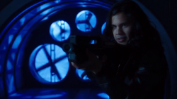 Cisco aims the rifle at Breacher.