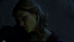 Supergirl suffering kryptonite poisoning