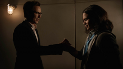 Eobard and Cisco try to do a handshake