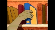 Hand grabbing book