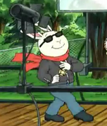 Buster wearing a black jacket, red scarf, sunglasses, blue pants, and black shoes