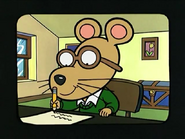 The main character, Alfred, writing a paper.