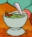 Mint ice cream with two cherries.