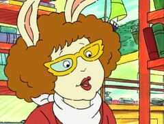 The left lens of Bitzi's glasses colored the same as the frame.