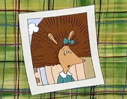 Prunella's third-grade photo; she got an electric shock from rubbing her feet across the carpet and sitting in a metal chair, which messed up her hair.