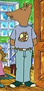 Mr. Ratburn in a Spooky Poo shirt and jeans