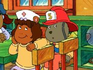 Wearing a nurse's hat for preschool career day.