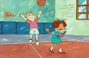 Playing basketball.