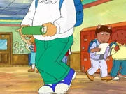 Brian in the hallways. He has on a blue backpack.