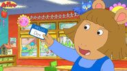 D.W. holding her nametag in Arthur's First Day