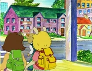 With her yellow backpack.