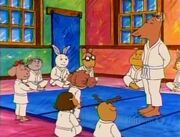 Arthur wearing a karate uniform.