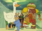 Arthur and the goose running from the food giant