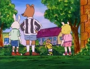 Wearing her sports clothes.