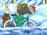 Wearing black mittens in "The Blizzard". He wears his regular clothes during the winter and in snow.