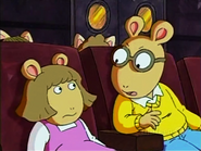 Arthur tells D.W. to be quiet in the theater