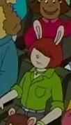 Molly in a green shirt, wearing a necklace, in "Don't Ask Muffy"