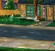 Lucy wearing a green swimsuit.