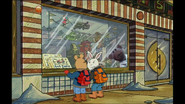 Nev #2 while Arthur and Buster look through the window of the store