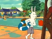 Wearing his swim trunks. Strangely, he wears them as his summer clothes.