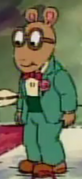 Arthur in his teal tuxedo with a red bowtie