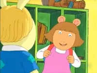 The teddy bear atop the shelf behind D.W. that wasn't there a few seconds ago.