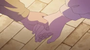 Lutz and Myne hold hands