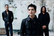 From left to right: Stefan Olsdal, Brian Molko, Steve Hewitt.