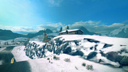 A lone cabin on top of a hillside near the track. Note the Christmas tree in the background.