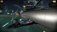 A McLaren MP4-31 trapped under the overturned tanker truck on the Rainbow Bridge.