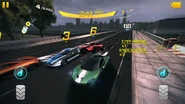 Two McLaren P1™s, an Aston Martin V12 Zagato, Aston Martin V12 Vantage, Lotus Exige S Coupe, and Lotus Evora Enduro GT at the beginning of a Classic race in Westminster Bridge.