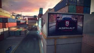 Screenshot 2018-08-13-23-02-37.png (2.5 MB) A billboard for Asphalt 9: Legends, seen near the shipping container dockyard.