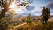 Promotional screenshot of Eivor looking over the countryside
