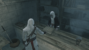 Altaïr prenant la plume à Jabal