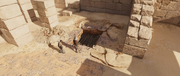 Bayek uncovering the vault's entrance