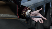 Haytham threatening Smythe with his Hidden Blade