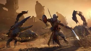 Bayek fighting several giant scorpions